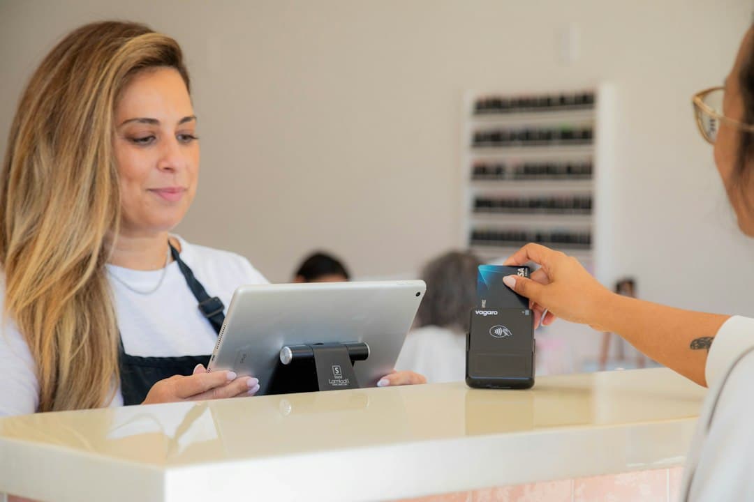 Customer paying by card at a front desk